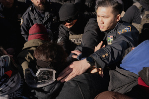 Immigration and Customs Enforcement (ICE) agents clear the entrance of the parking garage they rallied at before an attempted sweep on Canal Street in Manhattan. ICE has cracked down on vendors selling counterfit goods in New York City.