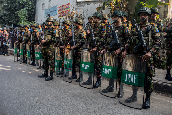Bangladeshi Military force stand on guard during a mock voting exercise at Sher-e-Bangla Nagar Government Girls High School. The Election Commission conducted a mock voting exercise from 8:00 a.m. to 12:00 p.m. for both the upcoming national election and referendum, which are likely to be held simultaneously on a single day in early February 2026.