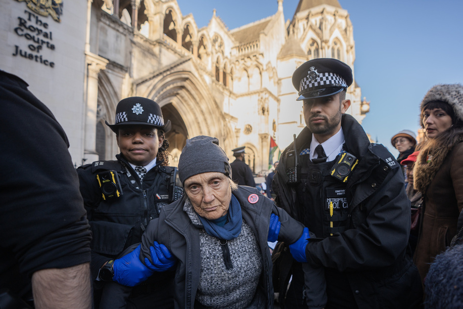 A non-compliant Palestine Action protester is carried away following arrest for holding up a sign in support of the proscribed group. Palestine Action protestors were once again arrested under the Terrorism Act for holding up signs in support of the proscribed group. The mass action outside the Royal Courts of Justice was coordinated to coincide with the judicial challenge of the proscription of Palestine Action which starts this week.