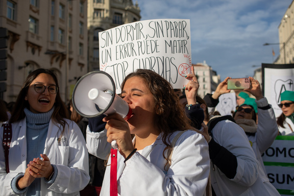 A protester carries a megaphone during a demonstration. Madrid doctors' union Amyts stage a protest the reform of the framework statute, which is part of a four-day strike and coincides with other demonstrations at healthcare centers in numerous Spanish cities.