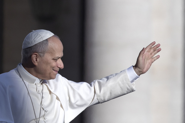 Pope Leo XIV waves as he arrives for his weekly general audience in St. Peter's square at the Vatican.