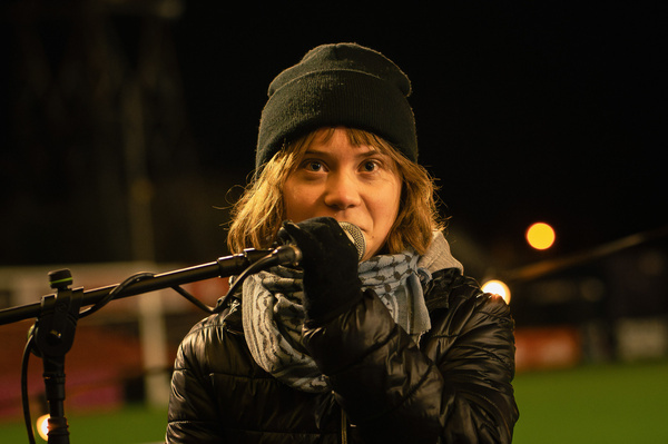 Greta Thunberg speaks to the crowd during the event at Dalymount Park. Greta Thunberg and Dr. Mohammed Abu Mughaisib spoke at Dalymount Park in a conversation hosted by Caoimhe Butterly, reflecting on the recent Gaza flotillas, the ongoing humanitarian crisis, and the role of solidarity. Thunberg highlighted the blockade's impact on civilians, the calls from people on the ground in Gaza, and the efforts of activists, including hunger strikers, to raise awareness and challenge systemic oppression.