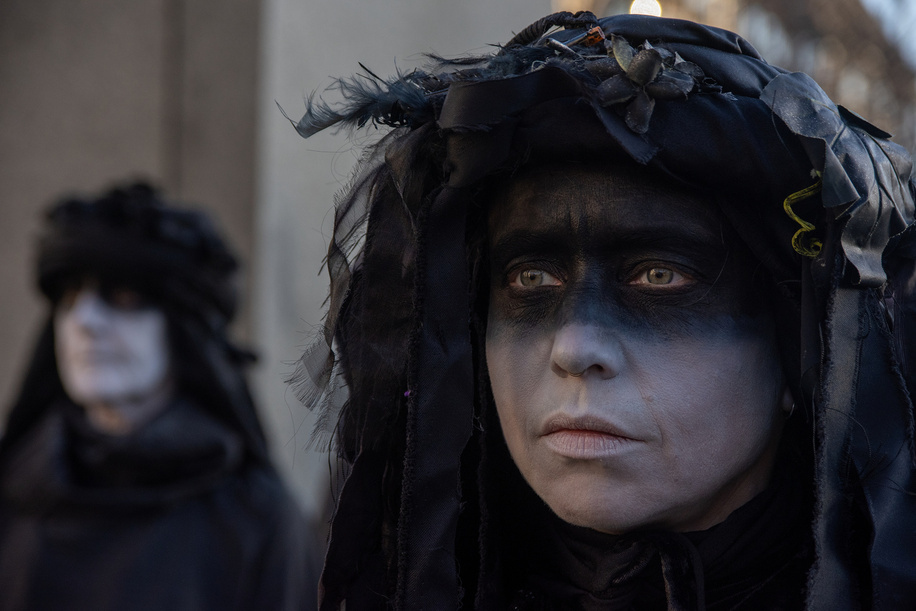 An oil slicker (a slow motion performer) poses for a portrait on the Parliament Square during the rally. Extinction Rebellion campaigners criticized political leaders for failing to meet climate commitments and because of the government's inaction over 1.5 degree target. The 1.5-degree target is the climate goal for limiting the man-made global temperature increase caused by the greenhouse effect.