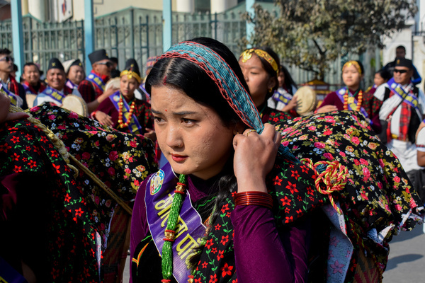 Nepalese Indigenous women from the Gurung community wearing traditional attire seen singing and dancing with their instruments as they take part in the parade to mark the New Year Tamu Lhosar festival.