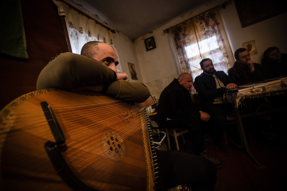 A soldier musician with his bandura at a concert for Ukrainian military personnel near the front line in Sumy. A music recital initiative is led by Cultural Forces, a platform founded by Ukrainian military personnel, artists, and volunteers that brings music and cultural support to soldiers on the front lines.