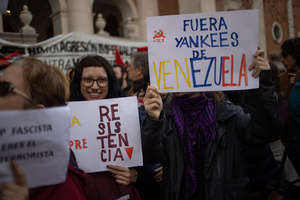 Protesters carry signs against the US and Donald Trump. During a rally organized by leftist groups in front of the US Embassy in Madrid to condemn the attacks carried out by the United States in Caracas in the early hours of January 3rd and the illegal arrest of President Nicolás Maduro and his transfer to a prison in New York along with his wife.
