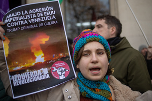 Protesters carry signs against the US. During a rally organized by leftist groups in front of the US Embassy in Madrid to condemn the attacks carried out by the United States in Caracas in the early hours of January 3rd and the illegal arrest of President Nicolás Maduro and his transfer to a prison in New York along with his wife.