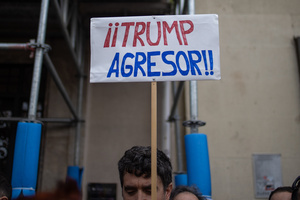 Protesters carry signs against the US and Donald Trump. During a rally organized by leftist groups in front of the US Embassy in Madrid to condemn the attacks carried out by the United States in Caracas in the early hours of January 3rd and the illegal arrest of President Nicolás Maduro and his transfer to a prison in New York along with his wife.