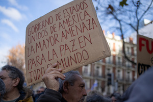 Protesters carry signs against the US and Donald Trump. During a rally organized by leftist groups in front of the US Embassy in Madrid to condemn the attacks carried out by the United States in Caracas in the early hours of January 3rd and the illegal arrest of President Nicolás Maduro and his transfer to a prison in New York along with his wife.