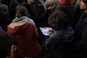 A protester writes a banner. During a rally organized by leftist groups in front of the US Embassy in Madrid to condemn the attacks carried out by the United States in Caracas in the early hours of January 3rd and the illegal arrest of President Nicolás Maduro and his transfer to a prison in New York along with his wife.