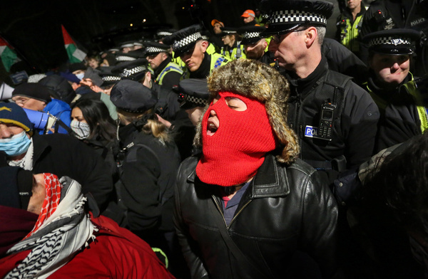 A protester in a full face covering shouts their message as the demonstration comes against the police cordon. Protesters gathered outside HMP New Hall, where Heba Muraisi is being held on remand after being arrested in November 2024 for alleged offences relating to Palestine Action. Her protest continues in jail by way of a hunger strike, where she has been refusing food for 62 days. Heba demands a return to HMP Bronzefield to be nearer her family and friends. Along with three other hunger strikers, she is also demanding a fair trial, an end to all censorship, immediate bail, the de-proscription of Palestine Action, and the closure of Israeli arms manufacturer Elbit Systems' UK sites.
