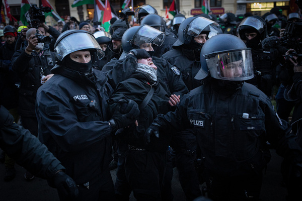 A group of police officers detains a pro-Palestinian female activist during the demonstration near the Connewitzer Kreuz in southern Leipzig. Several left-wing rallies and marches were held in Leipzig, bringing together groups with opposing views on Israel and Palestine. The largest pro-Palestinian march, held under the slogan “Antifa means: Free Palestine,” drew around 1,400 participants, while pro-Israeli and anti-antisemitism counter-demonstrations took place nearby, with more than 3,000 people attending eight registered events in total. Police mounted a large operation to keep groups apart and reported the situation as mostly peaceful, despite isolated scuffles and a small number of detentions.