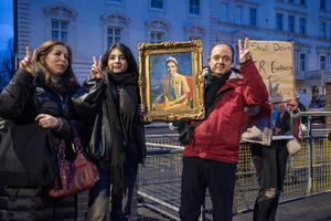 Protesters pose for a photo with a picture of Empress of Iran, Farah Pahlavi during the demonstration outside the Iranian Embassy in London. She is the mother of the Crown Prince pf Iran, Reza Pahlavi. Hundreds of Iranian royalists gathered outside the Iranian Embassy in London, UK. Protesters want to show their support to the anti-government protesters in Iran. Demonstrators intend to replace the Supreme Leader of Iran, Ayatollah Ali Khamenei, and his regime with the Crown Prince of Iran, Reza Pahlavi who lives in exile at the United States.