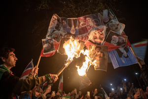 Protesters set on fire a banner with the Supreme Leader of Iran, Ayatollah Ali Khamenei during the demonstration outside the Iranian Embassy in London. Hundreds of Iranian royalists gathered outside the Iranian Embassy in London, UK. Protesters want to show their support to the anti-government protesters in Iran. Demonstrators intend to replace the Supreme Leader of Iran, Ayatollah Ali Khamenei, and his regime with the Crown Prince of Iran, Reza Pahlavi who lives in exile at the United States.