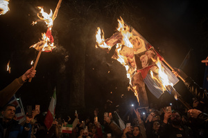 Iranian protesters hold the burning banner with the Supreme Leader of Iran, Ayatollah Ali Khamenei on it during the demonstration outside the Iranian Embassy in London. Hundreds of Iranian royalists gathered outside the Iranian Embassy in London, UK. Protesters want to show their support to the anti-government protesters in Iran. Demonstrators intend to replace the Supreme Leader of Iran, Ayatollah Ali Khamenei, and his regime with the Crown Prince of Iran, Reza Pahlavi who lives in exile at the United States.