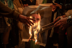Protesters set on fire of the poster of the Supreme Leader of Iran, Ayatollah Ali Khamenei during the demonstration outside the Iranian Embassy in London. Hundreds of Iranian royalists gathered outside the Iranian Embassy in London, UK. Protesters want to show their support to the anti-government protesters in Iran. Demonstrators intend to replace the Supreme Leader of Iran, Ayatollah Ali Khamenei, and his regime with the Crown Prince of Iran, Reza Pahlavi who lives in exile at the United States.