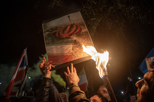 Protesters set on fire of the poster with the flag of the Islamic Republic of Iran during the demonstration outside the Iranian Embassy in London. Hundreds of Iranian royalists gathered outside the Iranian Embassy in London, UK. Protesters want to show their support to the anti-government protesters in Iran. Demonstrators intend to replace the Supreme Leader of Iran, Ayatollah Ali Khamenei, and his regime with the Crown Prince of Iran, Reza Pahlavi who lives in exile at the United States.