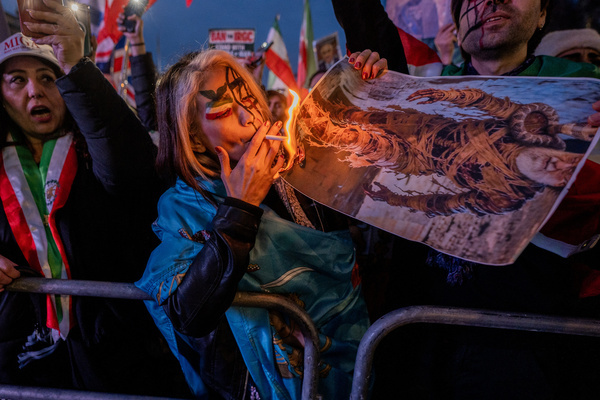 London Iranians burn images of the Ayatollah Ali Khamenei during a protest outside Downing Street. Thousands of London-based Iranians held a public rally outside Downing Street in London in support of the protestors in Iran calling for a regime change from clerical rule and for Ayatollah Ali Khamenei to step down.