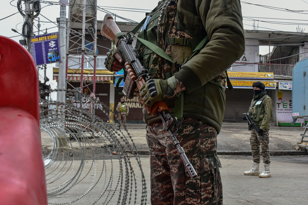 Paramilitary troopers stand alert at a temporary check-post during India's 77th Republic day celebrations in Srinagar the summer capital of Jammu and Kashmir. The authorities in Kashmir valley organized official functions to mark the 77th Republic Day amidst stepped up security vigil. Checkpoints have been erected at many places and frisking has been intensified.