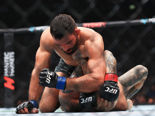 Benoit Saint Denis (L) of France seen in action with Dan Hooker (R) of New Zealand in a lightweight fight during the UFC 325 event at Qudos Bank Arena. Benoît Saint Denis of France defeated Dan Hooker of New Zealand in a lightweight bout during the UFC 325 event.