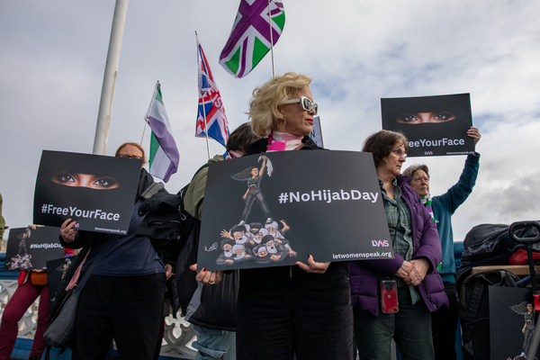 Women's rights activist Kelly-Jae Keen, holds a placard expressing her opinion during an anti Hijab demonstration. Women joined No Hijab Day on Tower Bridge, London, to highlight freedom of choice and expression. Organised to coincide with World Hijab Day, activists said the event aimed to raise awareness, not target any religion. Campaigner, Kelly-Jay Keen spoke in support of women who reject mandatory religious clothing.