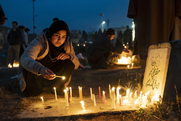 A Muslim girl lights candles on the grave of a relative during the Shab-e-Barat observance. Shab-e-Barat is observed by Muslims on the 14th–15th night of Sha‘ban, the eighth month of the Islamic calendar. The night is marked by prayers and supplications, as believers seek forgiveness and hold the belief that God determines human destinies. For Twelver Shia Muslims, the occasion carries added significance as it coincides with the birth anniversary of the 12th Imam, Muhammad al-Mahdi. Shia Muslims commemorate the night by lighting candles at the graves of relatives, illuminating homes and graveyards with lamps, offering prayers at burial sites, and observing nightlong prayers as expressions of devotion and remembrance of their Imam.