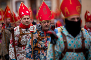 Members of the Endiablada brotherhood march, during the festival of La Endiablada in Almonacid del Marquesado. Celebrated in honor of the Virgin of Candelaria and Saint Blaise of Sebaste, La Endiablada is considered one of Spain’s oldest traditional festivals. During the event, men known as “the Devils,” dressed in colorful costumes with cowbells around their waists, jump and dance through the streets while carrying the statue of the saint in a lively procession.