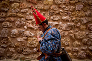 A member of the Endiablada brotherhood ties leather straps around his waist to hold the cowbells, during the festival of La Endiablada in Almonacid del Marquesado. Celebrated in honor of the Virgin of Candelaria and Saint Blaise of Sebaste, La Endiablada is considered one of Spain’s oldest traditional festivals. During the event, men known as “the Devils,” dressed in colorful costumes with cowbells around their waists, jump and dance through the streets while carrying the statue of the saint in a lively procession.