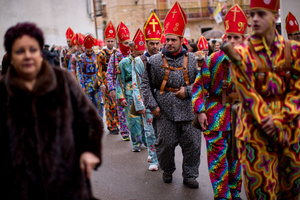 Members of the Endiablada brotherhood march, during the festival of La Endiablada in Almonacid del Marquesado. Celebrated in honor of the Virgin of Candelaria and Saint Blaise of Sebaste, La Endiablada is considered one of Spain’s oldest traditional festivals. During the event, men known as “the Devils,” dressed in colorful costumes with cowbells around their waists, jump and dance through the streets while carrying the statue of the saint in a lively procession.
