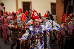 Members of the Endiablada brotherhood jump with open arms in front of the procession of the image of Saint Blaise, during the festival of La Endiablada in Almonacid del Marquesado. Celebrated in honor of the Virgin of Candelaria and Saint Blaise of Sebaste, La Endiablada is considered one of Spain’s oldest traditional festivals. During the event, men known as “the Devils,” dressed in colorful costumes with cowbells around their waists, jump and dance through the streets while carrying the statue of the saint in a lively procession.