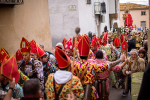 Members of the Endiablada brotherhood jump in front of the procession of the image of Saint Blaise, during the festival of La Endiablada in Almonacid del Marquesado. during the festival of La Endiablada in Almonacid del Marquesado. Celebrated in honor of the Virgin of Candelaria and Saint Blaise of Sebaste, La Endiablada is considered one of Spain’s oldest traditional festivals. During the event, men known as “the Devils,” dressed in colorful costumes with cowbells around their waists, jump and dance through the streets while carrying the statue of the saint in a lively procession.