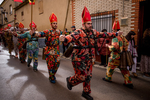 Members of the Endiablada brotherhood jump with open arms in front of the procession of the image of Saint Blaise, during the festival of La Endiablada in Almonacid del Marquesado. Celebrated in honor of the Virgin of Candelaria and Saint Blaise of Sebaste, La Endiablada is considered one of Spain’s oldest traditional festivals. During the event, men known as “the Devils,” dressed in colorful costumes with cowbells around their waists, jump and dance through the streets while carrying the statue of the saint in a lively procession.