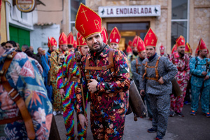 Members of the Endiablada brotherhood prepare to dance toward the town cemetery, during the festival of La Endiablada in Almonacid del Marquesado. Celebrated in honor of the Virgin of Candelaria and Saint Blaise of Sebaste, La Endiablada is considered one of Spain’s oldest traditional festivals. During the event, men known as “the Devils,” dressed in colorful costumes with cowbells around their waists, jump and dance through the streets while carrying the statue of the saint in a lively procession.