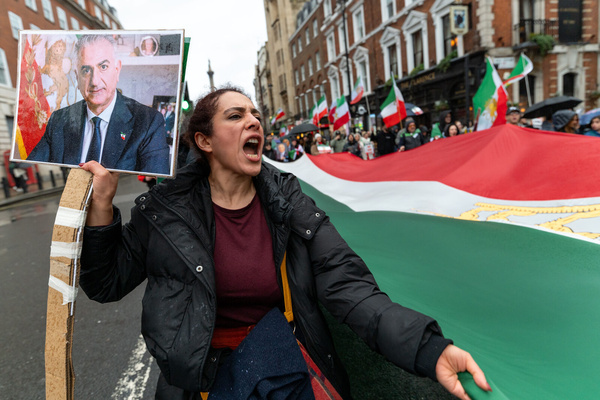 A woman chants slogans while holding a portrait of Reza Pahlavi. Members of the Iranian diaspora marched through central London from Marble Arch to Downing Street in protest against the Iranian government, calling for an end to repression and political violence in Iran. Demonstrators carried Iranian flags, chanted anti-government slogans, and urged the UK and international community to take a firmer stance in support of human rights and democratic change.