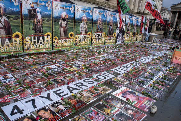 Photos, signs and posters displayed outside the National Gallery on the Trafalgar Square in London. Iranian activists set up a display on the Trafalgar Square in London, UK. To show the oppression and terror to the British public what is happening back in Iran. Activists wants the President of the United States, Donald Trump to intervene to the situation in Iran and replace the Supreme Leader of Iran, Ayatollah Ali Khamenei and his regime by the Crown Prince of Iran, Reza Pahlavi who lives in exile at the United States.