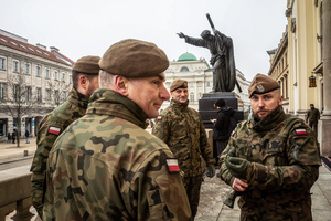 Soldiers gather underneath a statue of Christ bearing the cross. On the afternoon of the 14th of February, Poland celebrates the National Day of Remembrance of the Home Army Soldiers, a state holiday commemorating the Polish underground militias during World War II. After a Mass for the fallen at the Basilica of the Holy Cross, a Parade of Respect passes through the streets of Warsaw in the direction of the Monument to the Polish Underground State and the Home Army at the Polish Parliament, where a wreath-laying ceremony takes place.