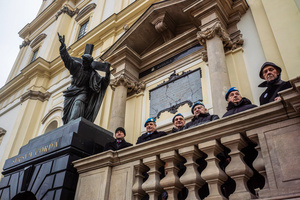 Members of the parade stand under the statue of Christ bearing the cross. On the afternoon of the 14th of February, Poland celebrates the National Day of Remembrance of the Home Army Soldiers, a state holiday commemorating the Polish underground militias during World War II. After a Mass for the fallen at the Basilica of the Holy Cross, a Parade of Respect passes through the streets of Warsaw in the direction of the Monument to the Polish Underground State and the Home Army at the Polish Parliament, where a wreath-laying ceremony takes place.