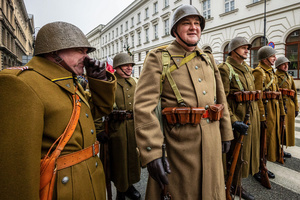 Historical reenactors in period military dress are seen in the parade. On the afternoon of the 14th of February, Poland celebrates the National Day of Remembrance of the Home Army Soldiers, a state holiday commemorating the Polish underground militias during World War II. After a Mass for the fallen at the Basilica of the Holy Cross, a Parade of Respect passes through the streets of Warsaw in the direction of the Monument to the Polish Underground State and the Home Army at the Polish Parliament, where a wreath-laying ceremony takes place.