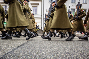 Historical reenactors in period military dress march in the parade. On the afternoon of the 14th of February, Poland celebrates the National Day of Remembrance of the Home Army Soldiers, a state holiday commemorating the Polish underground militias during World War II. After a Mass for the fallen at the Basilica of the Holy Cross, a Parade of Respect passes through the streets of Warsaw in the direction of the Monument to the Polish Underground State and the Home Army at the Polish Parliament, where a wreath-laying ceremony takes place.