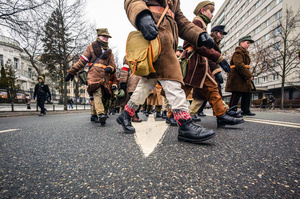 Historical reenactors in period military dress march in the parade. On the afternoon of the 14th of February, Poland celebrates the National Day of Remembrance of the Home Army Soldiers, a state holiday commemorating the Polish underground militias during World War II. After a Mass for the fallen at the Basilica of the Holy Cross, a Parade of Respect passes through the streets of Warsaw in the direction of the Monument to the Polish Underground State and the Home Army at the Polish Parliament, where a wreath-laying ceremony takes place.