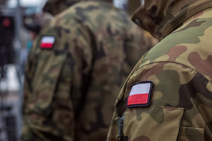 The Polish flag is seen on the uniforms of soldiers of the Polish army. On the afternoon of the 14th of February, Poland celebrates the National Day of Remembrance of the Home Army Soldiers, a state holiday commemorating the Polish underground militias during World War II. After a Mass for the fallen at the Basilica of the Holy Cross, a Parade of Respect passes through the streets of Warsaw in the direction of the Monument to the Polish Underground State and the Home Army at the Polish Parliament, where a wreath-laying ceremony takes place.