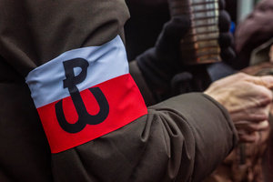 An armband bearing the symbol of the Warsaw Uprising is seen during the ceremony. On the afternoon of the 14th of February, Poland celebrates the National Day of Remembrance of the Home Army Soldiers, a state holiday commemorating the Polish underground militias during World War II. After a Mass for the fallen at the Basilica of the Holy Cross, a Parade of Respect passes through the streets of Warsaw in the direction of the Monument to the Polish Underground State and the Home Army at the Polish Parliament, where a wreath-laying ceremony takes place.