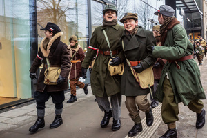 Young historical reenactors in period military dress are seen after the ceremony. On the afternoon of the 14th of February, Poland celebrates the National Day of Remembrance of the Home Army Soldiers, a state holiday commemorating the Polish underground militias during World War II. After a Mass for the fallen at the Basilica of the Holy Cross, a Parade of Respect passes through the streets of Warsaw in the direction of the Monument to the Polish Underground State and the Home Army at the Polish Parliament, where a wreath-laying ceremony takes place.