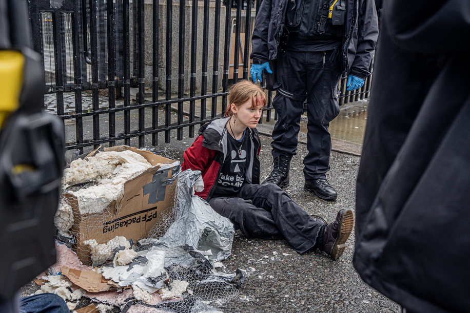 A protester is arrested for blocking the entrance to the Houses of Parliament. Two young protesters from the activist group “Take Back Power” glued themselves to a papier-mâché effigy of Keir Starmer outside Parliament, calling for his resignation. They were later cut free from the sculpture and arrested.