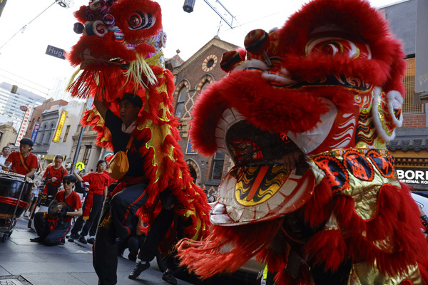 Lion dance performers seen moving through the streets during the Lunar new year eve day celebration. Lunar New Year’s Eve celebrations take place at Melbourne Chinatown, where crowds gather to welcome the new lunar year with cultural performances, traditional decorations, and community festivities celebrating Asian heritage and renewal.