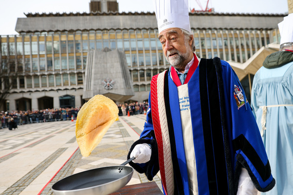 A participant flips a pancake during the Inter-Livery Pancake Race at Guildhall Yard in the City of London on Shrove Tuesday, raising funds for the Lord Mayor's Charity. Members of the City Livery Companies took part in the annual event, also known as the Poulters' Pancake Race, racing in ceremonial robes and fancy dress. The event has been held annually since 1983.