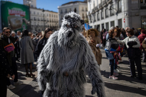 A man dressed as a grizzly bear is seen. during the 1st Masquerade Parade through the center of Madrid, organized by the regional associations of Asturias, Galicia, and Zamora, the heart of the Spanish capital was transformed into a stage for ancestral rites from the Spanish regions of Asturias, Galicia, and Zamora.