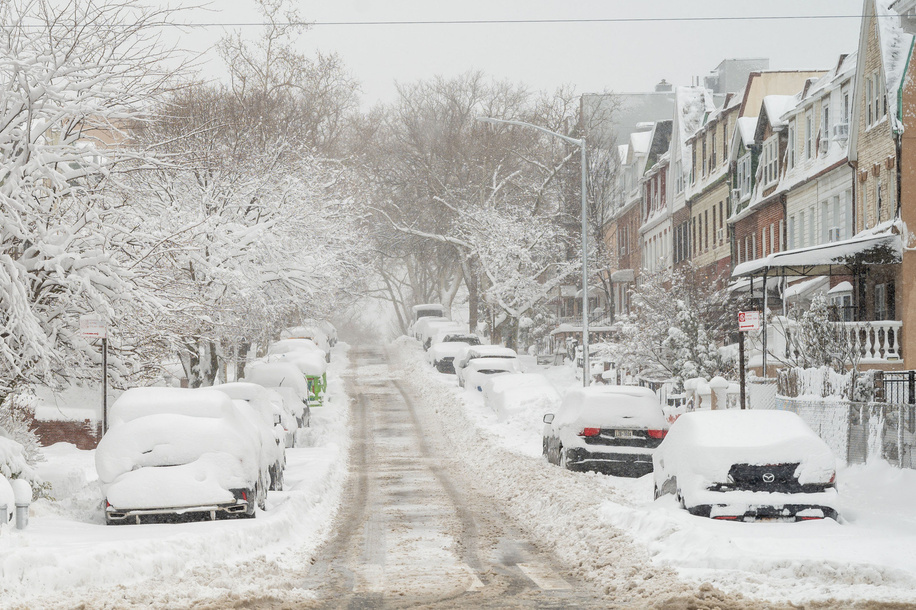 Snow blankets brownstones seen amid a nor'easter with blizzard conditions on February 23, 2026 in the Queens borough of New York City.