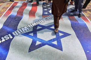 Kashmiri Shiite Muslim protesters walk on the U.S. and Israeli flags during a protest rally against the killing of the Iranian Supreme Leader, Ayatollah Ali Khamenei, in Budgam, about 25kms from Srinagar. Protests continue across the Kashmir valley over the killing of Iran's Supreme Leader Ayatollah Ali Khamenei in a coordinated US-Israeli airstrike on Tehran. Strict restrictions remained imposed in many areas of Kashmir for the fifth consecutive day.