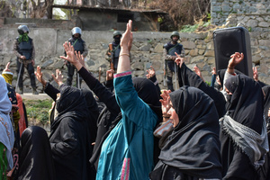 Paramilitary troopers stand alert as Kashmiri Shiite Muslim protesters shout slogans during a protest rally against the killing of the Iranian Supreme Leader, Ayatollah Ali Khamenei, in Budgam, about 25kms from Srinagar. Protests continue across the Kashmir valley over the killing of Iran's Supreme Leader Ayatollah Ali Khamenei in a coordinated US-Israeli airstrike on Tehran. Strict restrictions remained imposed in many areas of Kashmir for the fifth consecutive day.
